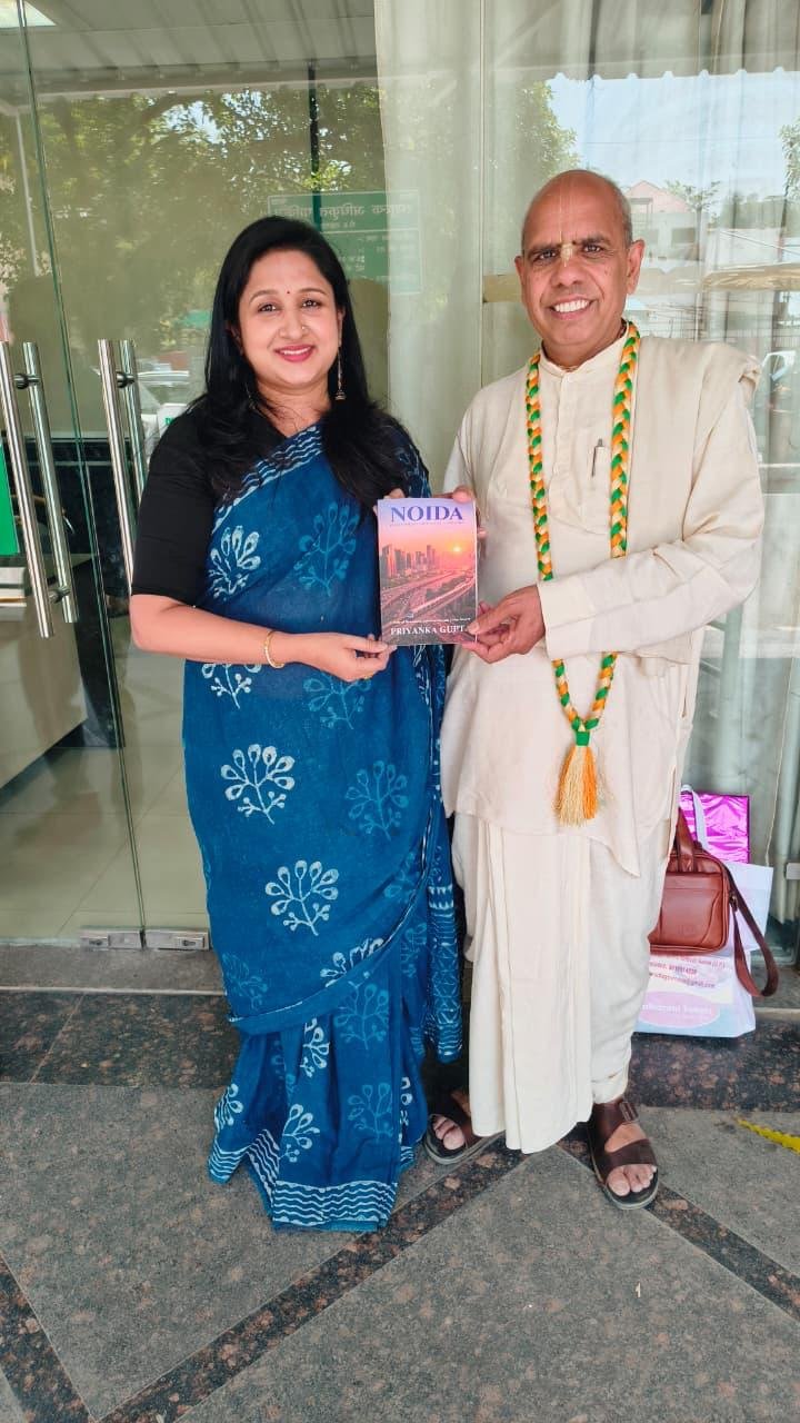 Book 'Noida' — Presented to ISKCON Noida Co-President Shri Vansidhar Mahaprabhu