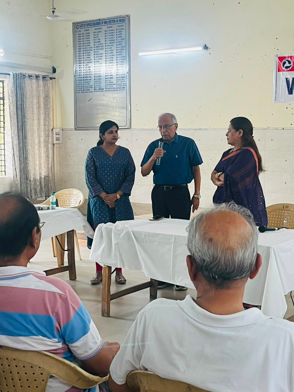 Senior RWA member speaking at the SamaajSevika health camp for senior citizen women in Sector 40, Noida